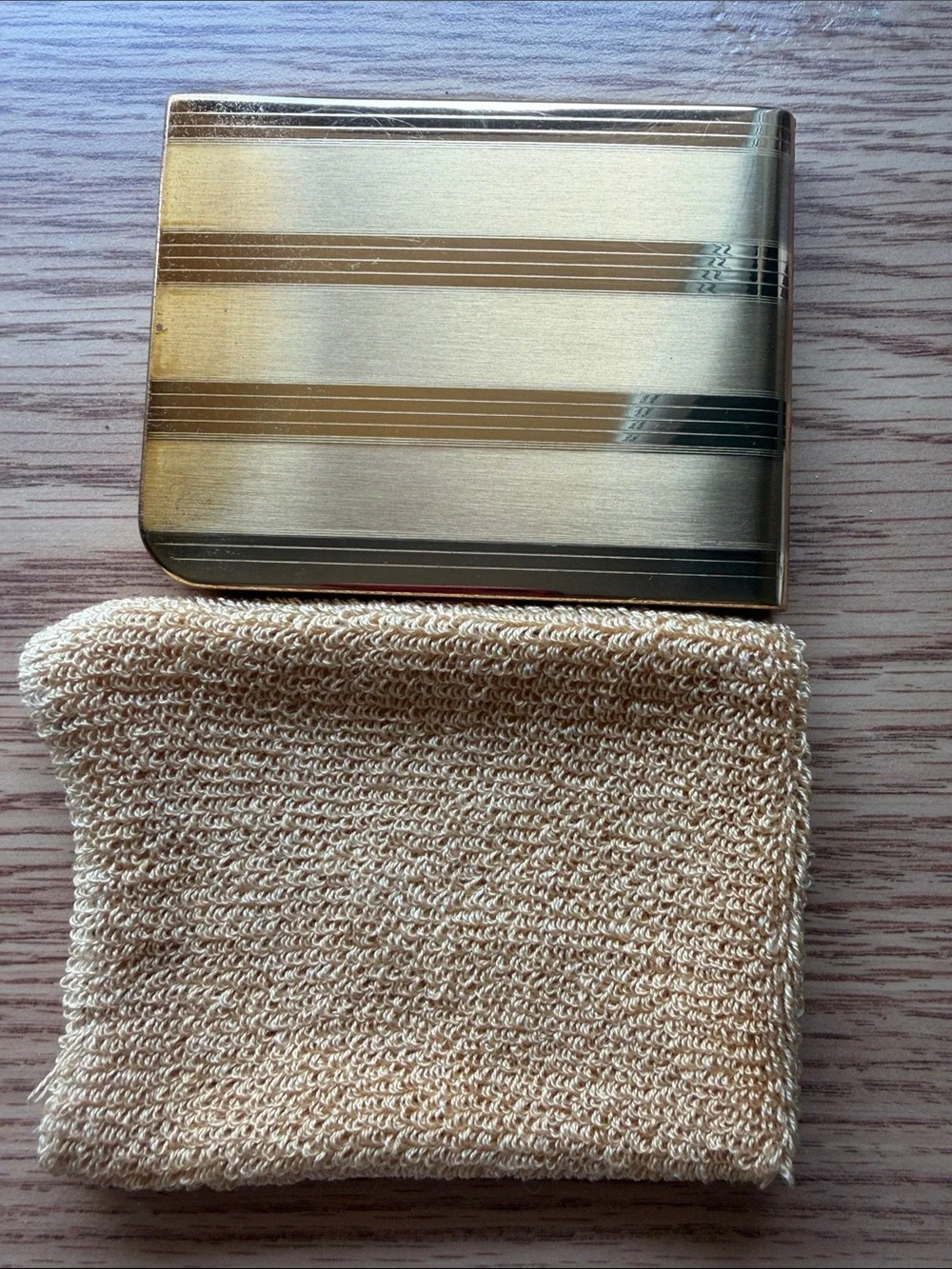 Vintage Elgin American cigarette case features a striking striped gold pattern